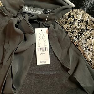 Black top with black lace and gold bell sleeves. Can dress up or down.